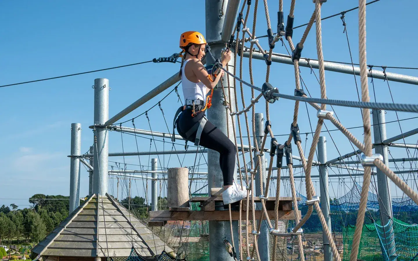 A participant on the high ropes course at Out of Bounds, West Sussex